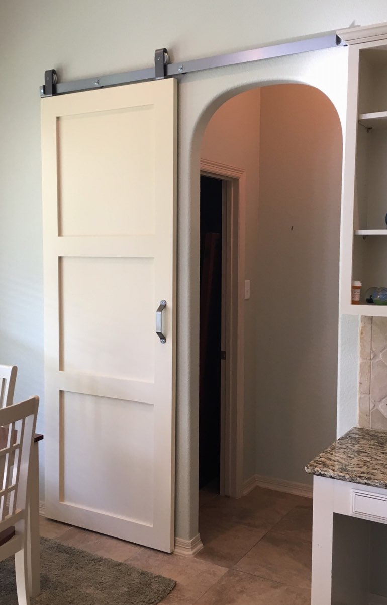 Contemporary style barn door in San Diego kitchen.